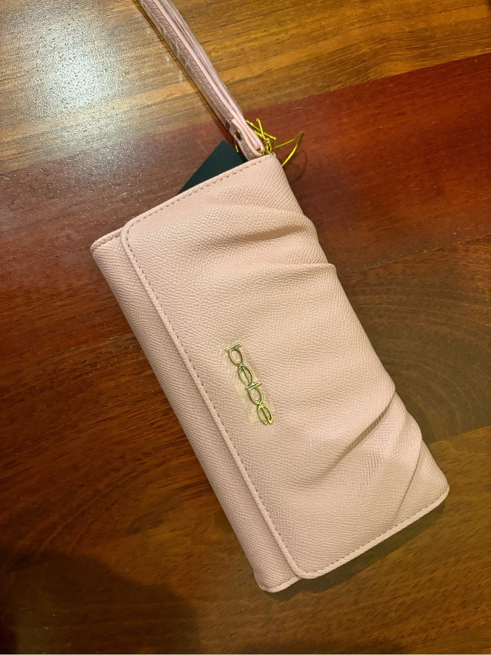bebe Pale Pink Wristlet Clutch with Gold Logo